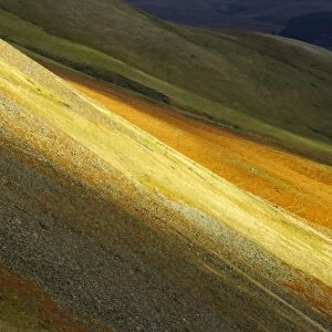 England, Cumbria, Yorkshire Dales National Park. A shaft of light illuminates the hills of the park