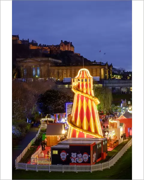 Scotland, Edinburgh, Princes Street Christmas Market. A traditional European Christmas Market located along Princes Street with the Scottish National Gallery and Edinburgh Castle in view