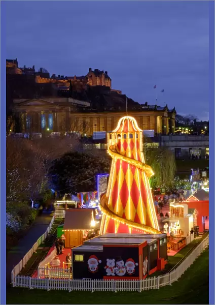 Scotland, Edinburgh, Princes Street Christmas Market. A traditional European Christmas Market located along Princes Street with the Scottish National Gallery and Edinburgh Castle in view