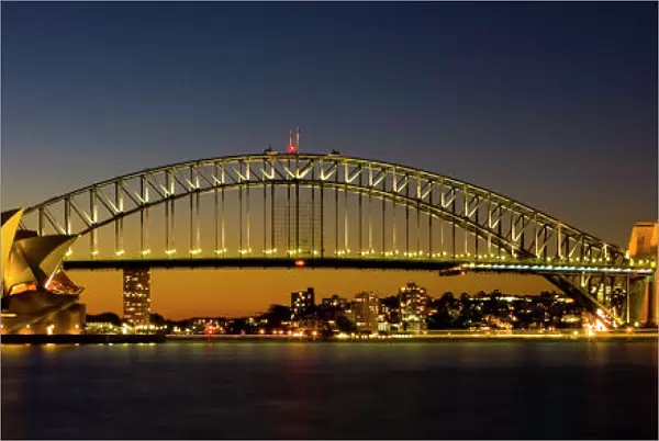 Australia, New South Wales, Sydney. Sydney Harbour bridge and the opera house viewed at dusk