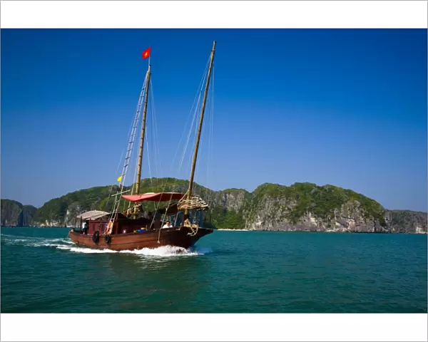 Vietnam, Northern Vietnam, Halong Bay. Tourist boat amid the islands of Halong Bay near Cat Ba Island