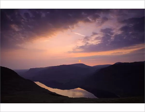 ENGLAND, Cumbria, Lake District National Park. Sunset reflected in the still waters of Wast Water Englands