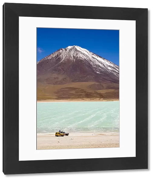 Bolivia, Southern Altiplano, Laguna Verde. Tourist trip 4x4s parked near Laguna Verde