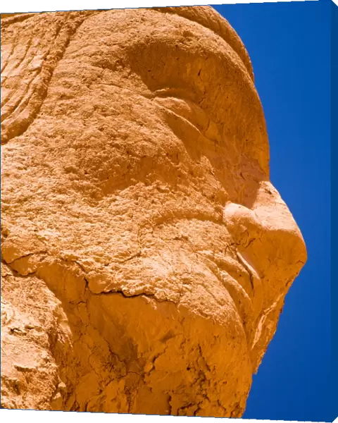 Chile, Atacama Desert, Plaza Quitor. Carved face in the stone wall of the Atacama Desert near the Plaza