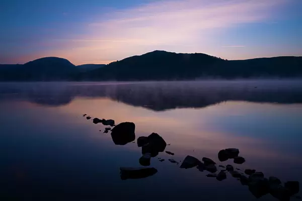 England, Cumbria, Lake District National Park. Dawn at Low Wray, looking across the still waters of Windermere, the largest lake to be found