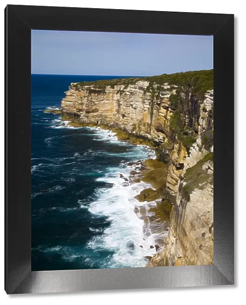 Australia, New South Wales, Royal National Park. Sandstone cliifs overlooking the Pacific Ocean viewed from the Royal National Park