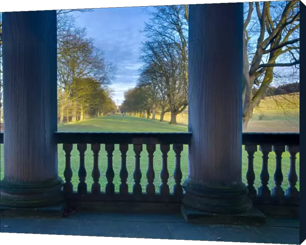 England, Tyne and Wear, Gibside. Looking through the stone pillars of the Gibside Chapel towards the half mile, Oak tree lined walk heading to the Column