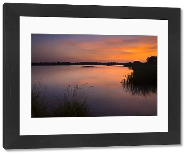 England, Tyne and Wear, Big Waters County Park. Sunset over the lake in Big Waters Country Park The lake is a a subsidence pond, formed by the collapse of old