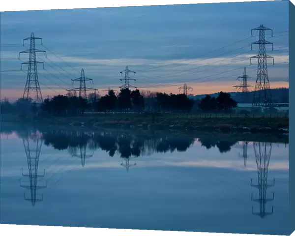 England, Tyne & Wear, Newburn. Electricity pylons distribute electricity across the River Tyne from Ryton