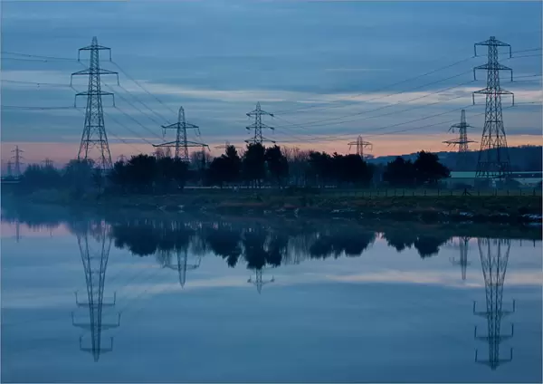 England, Tyne & Wear, Newburn. Electricity pylons distribute electricity across the River Tyne from Ryton