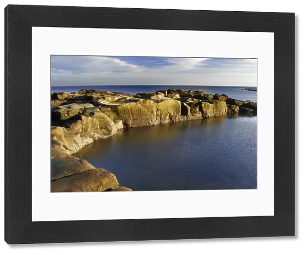 A swimming and bathing pool cut into the rocky coastline of the North Sea in North Tyneside