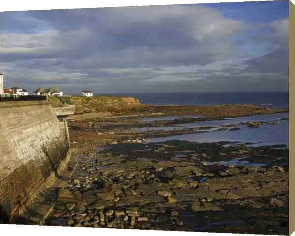 A sea wall built to defend the North Tyneside village of Cullercoats from the forces of the North Sea