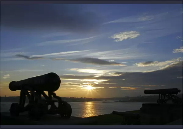 Sunset behind the river Tyne and the Collingwood Cannons