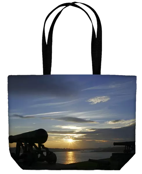 Sunset behind the river Tyne and the Collingwood Cannons