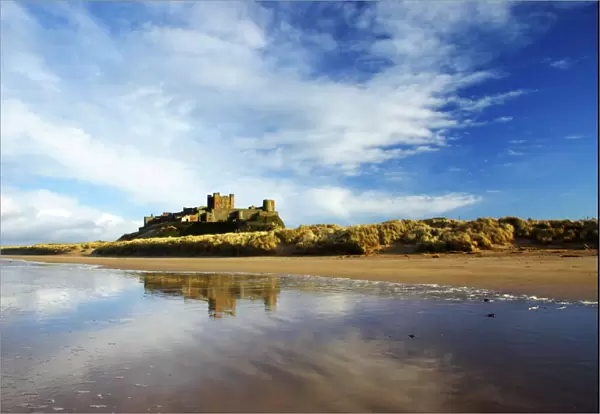 England, Northumberland, Bamburgh Castle. Bamburgh Castle and dunes near Bamburgh village