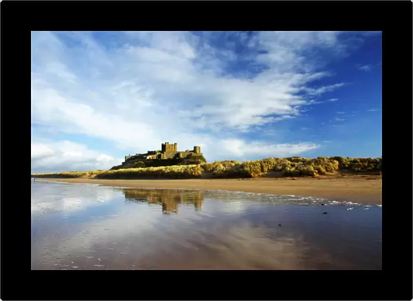 England, Northumberland, Bamburgh Castle. Bamburgh Castle and dunes near Bamburgh village