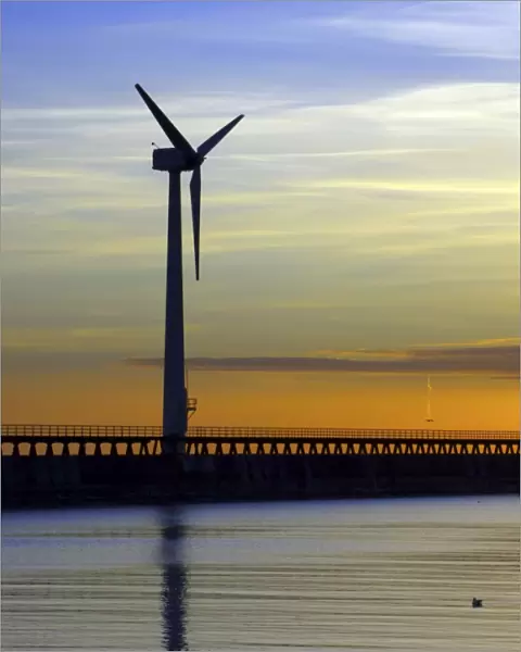 England, Northumberland, Blyth offshore wind farm. Dawn, looking towards the wind turbines generating