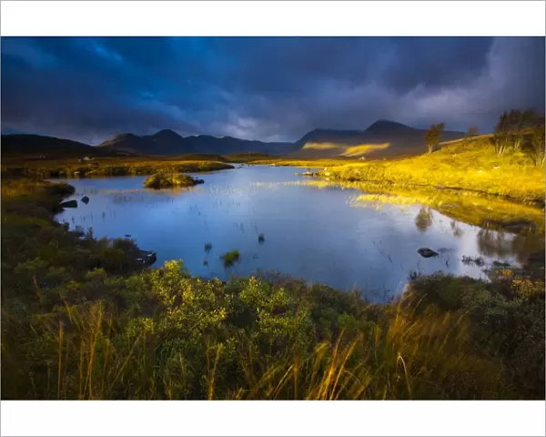 Scotland, Scottish Highlands, Rannoch Moor. Lochan an Stainge located on Rannoch Moor with the dominating peak of the Black Mount and surrounding mountains in