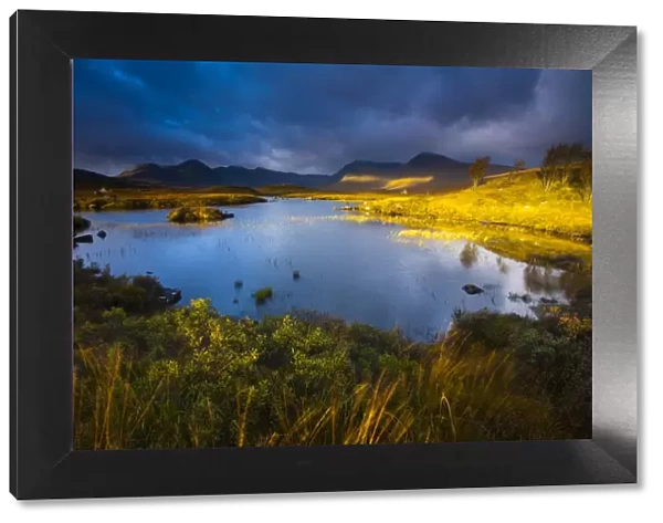 Scotland, Scottish Highlands, Rannoch Moor. Lochan an Stainge located on Rannoch Moor with the dominating peak of the Black Mount and surrounding mountains in
