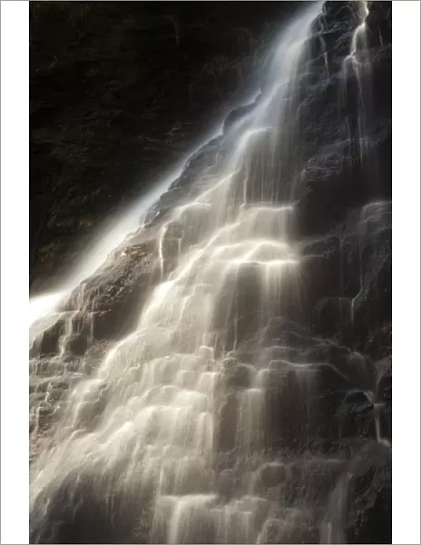 England, Northumberland, Hareshaw Linn. Hareshaw Linn is a spectacular waterfall located in a steep sided gorge, which continues to flow through a wooded valley. Hareshaw Linn is located near Bellingham within the Northumberland