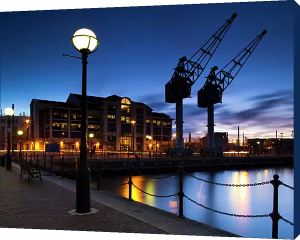 England, Greater Manchester, Salford Quays. Cranes overlooking Ontario Basin part of the recently redeveloped Salford Quays in