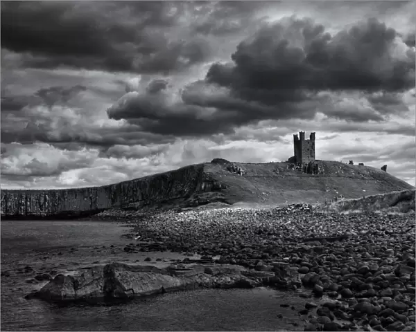 England, Northumberland, Embleton Bay. The Lilburn Tower, part of the remains of Dunstanburgh Castle, viewed from Embleton Bay