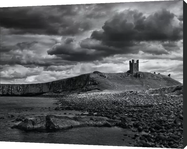 England, Northumberland, Embleton Bay. The Lilburn Tower, part of the remains of Dunstanburgh Castle, viewed from Embleton Bay
