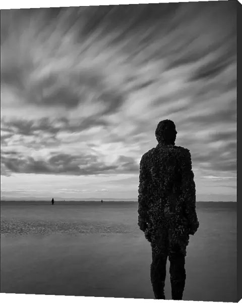 England, Merseyside, Antony Gormley Another Place. Antony Gormley sculptures at Crosby Beach near Liverpool in England