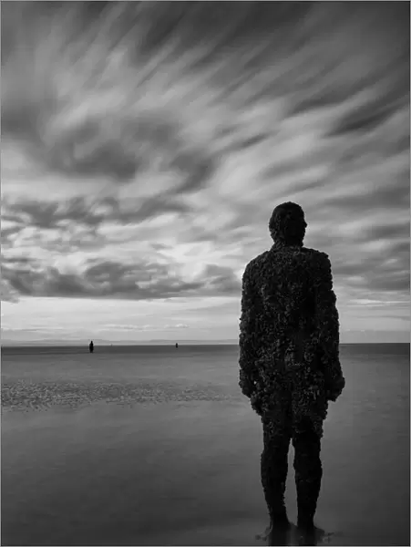 England, Merseyside, Antony Gormley Another Place. Antony Gormley sculptures at Crosby Beach near Liverpool in England