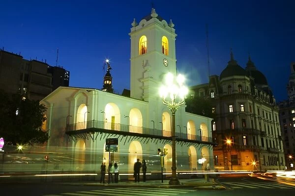 Argentina, Buenos Aires Province, Buenos Aires. Dusk scene of the Cabildo in the Plaza De Mayo in Buenos