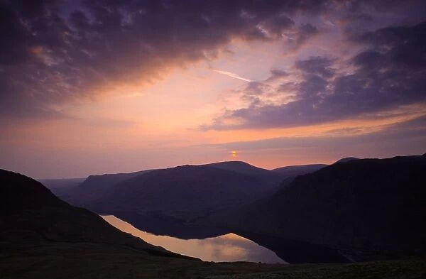 ENGLAND, Cumbria, Lake District National Park. Sunset reflected in the still waters of Wast Water Englands