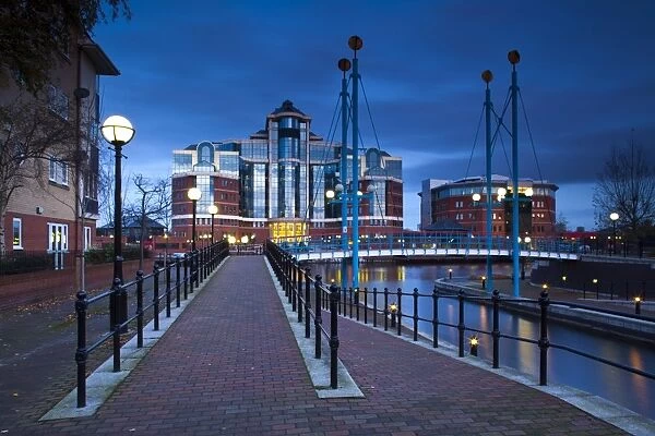 England, Greater Manchester, Salford Quays. Victoria Harbour building beyond Mariners Canal footbridge on the Manchester Ship Canal located