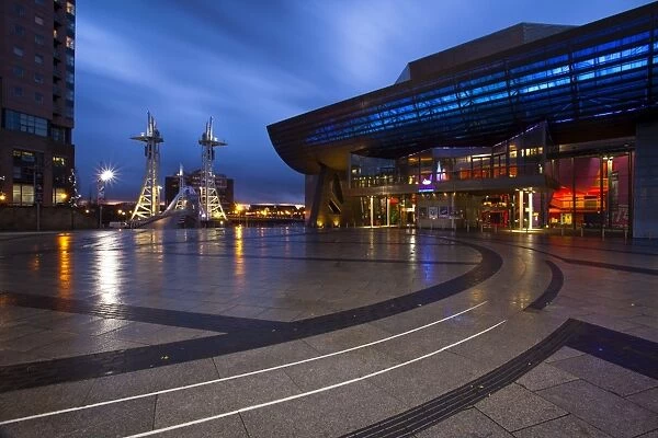 England, Greater Manchester, Salford Quays. The Lowry Centre at dusk looking towards the Lowry Bridge, located on the Salford Quays in the city of Salford near Manchester