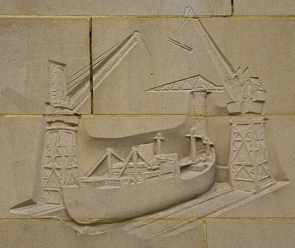 England, Tyne and Wear, Newcastle Upon Tyne. Carving on the reconstructed city wall near the quayside heralding the ship building heydays of Newcastle