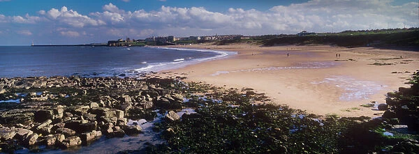 England, Tyne and Wear, Tynemouth. Looking south on a mid summers day across the Tynemouth Long Sands towards the Priory, Castle and the mouth of the Tyne. Recently there has been a great deal of conservation work undertaken to help preserve