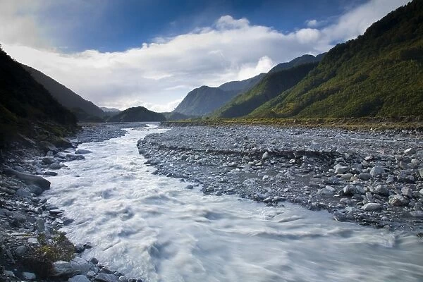 NEW ZEALAND, Westland, Westland National Park. Glacial valley and river downstream of the Franz Josef