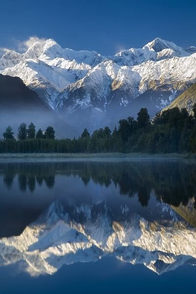 New Zealand, Westland, Westland National Park. Mt Cook and Mt Tasman reflected in the still waters of