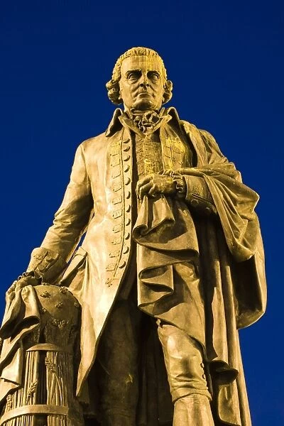 Scotland, Edinburgh, The Royal Mile. Statue of Adam Smith, considered by many to be the father of modern economics, looking towards his home town of Kircaldy across the