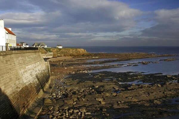A sea wall built to defend the North Tyneside village of Cullercoats from the forces of the North Sea