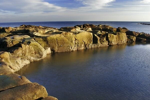 A swimming and bathing pool cut into the rocky coastline of the North Sea in North Tyneside