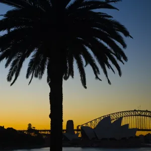 Australia, New South Wales, Sydney. Sydney Harbour bridge and the opera house viewed at sunset