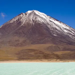 Bolivia, Southern Altiplano, Laguna Verde. Tourist trip 4x4s parked near Laguna Verde