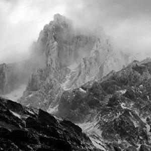 Chile, Southern Patagonia, Torres Del Paine National Park. Storm clouds clear to reveal a fresh sprinkling of snow on the Paine Grande