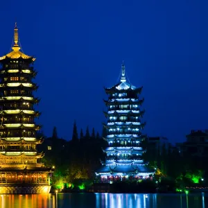 China, Guangxi Zhuang Autonomous Region, Guilin City. Illuminated Pagodas at dusk