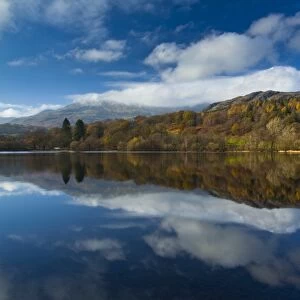 England, Cumbria, Lake District National Park. Lakeland hills reflected upon the still face of Coniston