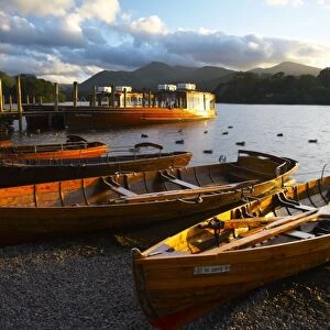 England, Cumbria, Lake District National Park. Wooden rowing boats and Derwent Water