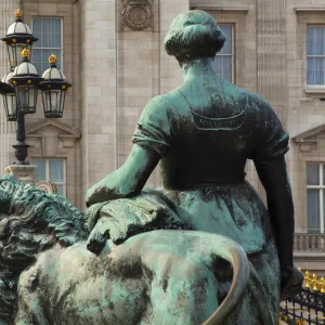 England, Greater London, City of Westminster. Bronze statue on the Victoria Memorial in Queens Garden, looking towards Buckingham Palace in