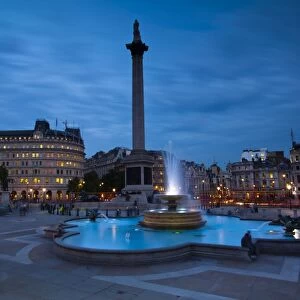England, Greater London, City of Westminster. Nelsons Column and nearby fountains in Trafalgar Square, a popular tourist destination in London, photographed