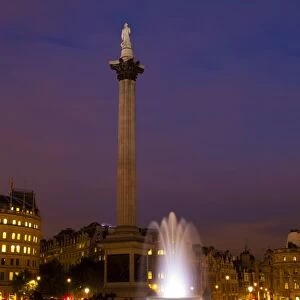 England, Greater London, City of Westminster. Nelsons Column and nearby fountains in Trafalgar Square, a popular tourist destination in London, photographed