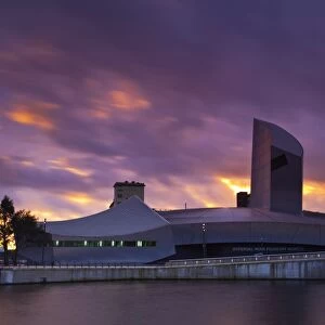 England, Greater Manchester, Salford Quays. Sunset behind the Imperial War Museum North